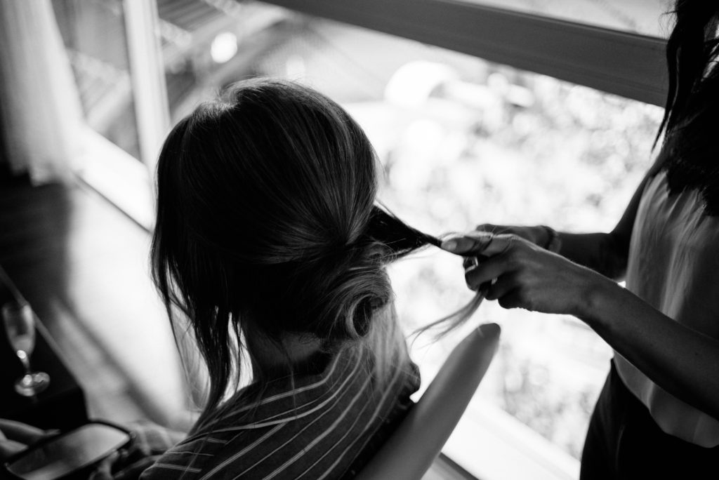 close up of bride getting her hair done by the hairdresser